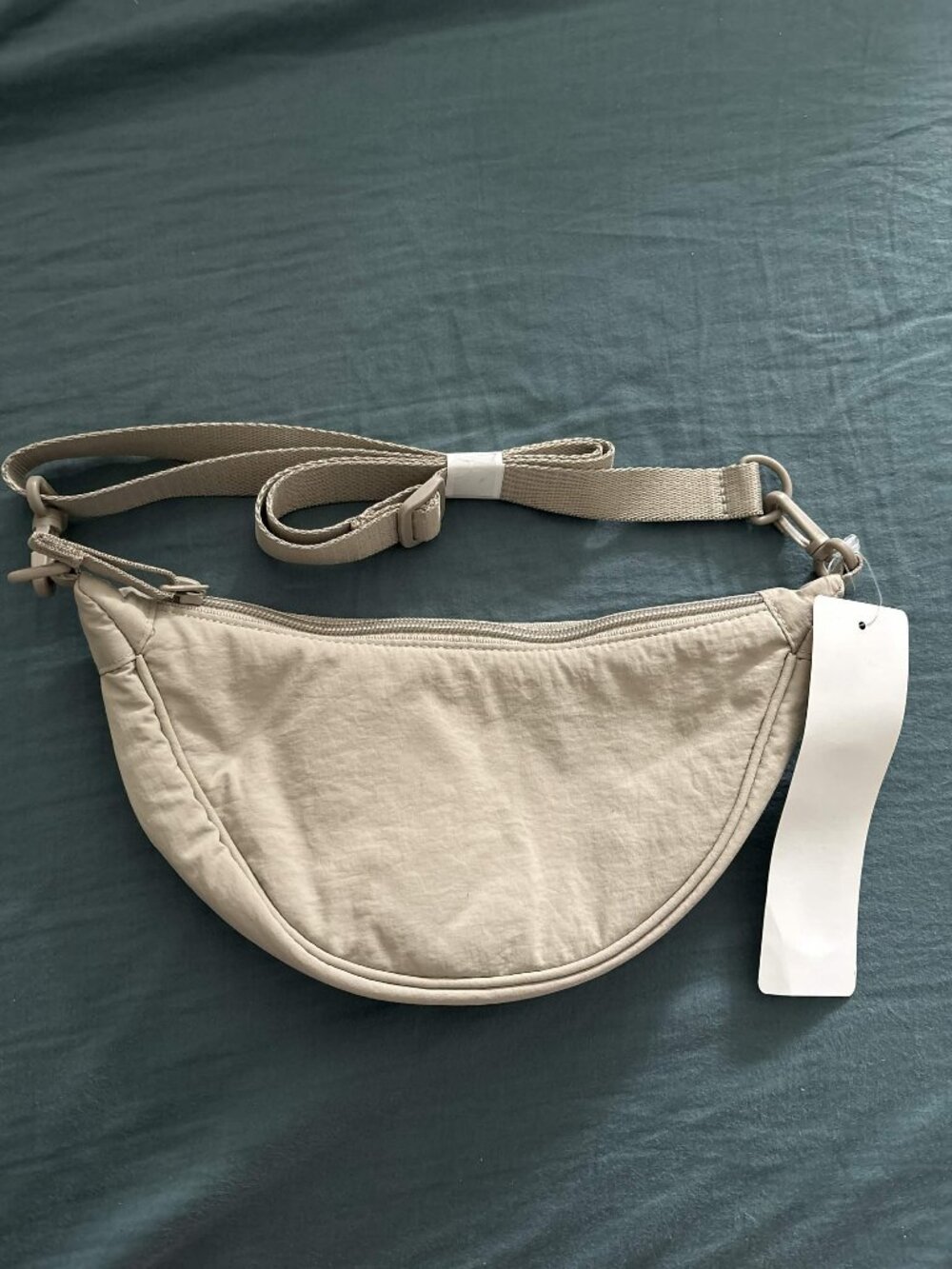 UNIQLO Small Beige Crescent Crossbody Bag